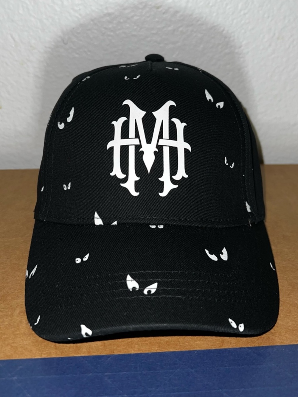 Disney Black Hat with White Eye Print and White Logo
